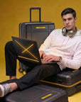 Black cabin trolley suitcase with upright handle and integrated top compartment, 8 wheels.