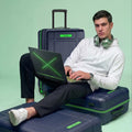 Navy polycarbonate trolley suitcase with extended handle and green-trim detail in use