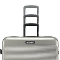 Silver hard-shell suitcase with telescopic handle and HRX badge