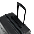 Medium check-in suitcase, dark hard shell corner with textured grip and side latch