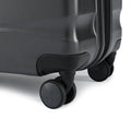 Medium check-in suitcase corner with 8-wheel base and smooth hard shell in dark color
