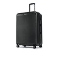 Charcoal grey hard-shell suitcase with telescopic handle and 8 spinner wheels