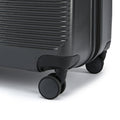 Black hard-shell luggage suitcase with four-spoke wheels and rounded corner bumper