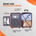 Open small cabin suitcase interior, grey fabric pockets and straps with orange trim