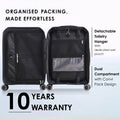 Opened dark blue hard-shell polycarbonate suitcase with dual compartments and wet pouch