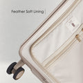 Beige hard-shell polycarbonate trolley luggage with feather-soft interior lining detail