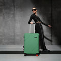 Medium check-in suitcase, green hard shell with 8 wheels and telescopic handle