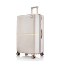 Beige hard-shell polycarbonate trolley suitcase front view with side handle and four wheels