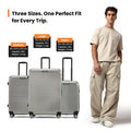 Silver hard-shell wheeled suitcases with handles and four spinner wheels each
