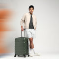 Large check-in suitcase with telescopic handle and spinner wheels, olive green