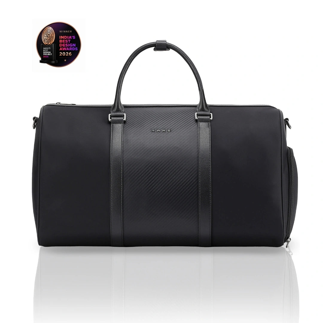 Black duffle bag with top handles, zip closure, and side shoulder strap.