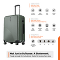 Dark green suitcase with telescopic handle, ribbed shell and rotating wheels.