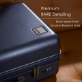 Dark blue hard-shell polycarbonate suitcase close-up of brush metal finish detail