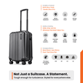 Dark grey cabin suitcase with telescopic handle and four spinner wheels, side view
