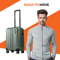 Small cabin suitcase, dark green hard-shell with vertical ridges and four spinner wheels