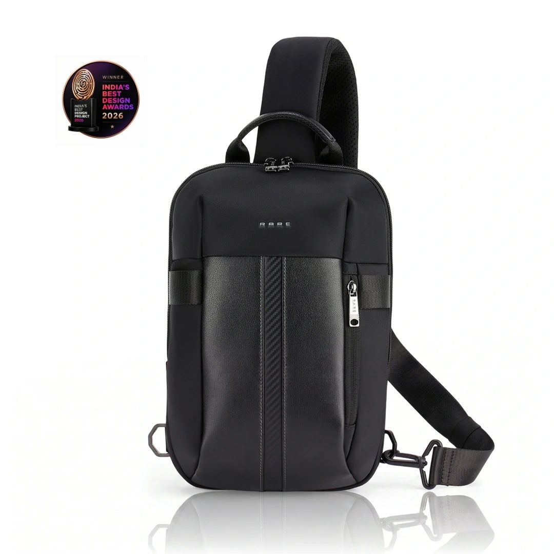 Black crossbody sling bag with front zipper, padded sides, and adjustable shoulder strap.