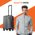 Small cabin suitcase, charcoal hard-shell with vertical ridges and four spinner wheels
