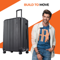 Charcoal grey hard-shell suitcase with side handle and four spinner wheels.