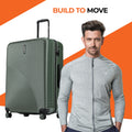 Dark green ribbed check-in suitcase with upright handle and four caster wheels.