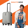 Silver cabin suitcase with black telescopic handle and ribbed textured shell