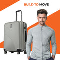 Silver ridged check-in suitcase with top handle and 8 spinner wheels