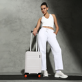 White small cabin suitcase with extendable handle and four spinner wheels