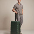 Small cabin suitcase, dark green polycarbonate with 8 wheels and telescopic handle