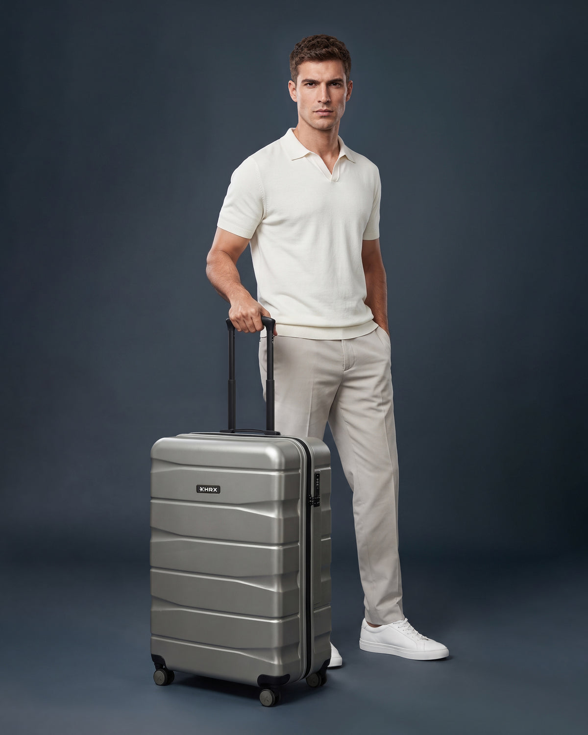 Small cabin suitcase, silver polycarbonate with 8 wheels and telescopic handle