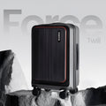 Black twill trolley suitcase with front panel, side handle, and four spinner wheels