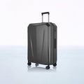 Charcoal hard-shell trolley luggage, front view with side zipper and spinner wheels