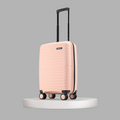 Peach small cabin suitcase with upright handle and 8 spinner wheels.