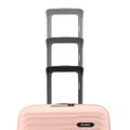 Stack of peach small cabin suitcases with black handles and ridged front panels.