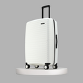 White large check-in suitcase with ribbed hard shell, black side handle, and spinner wheels.