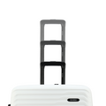 Large check-in suitcase with telescopic handle in dark color; white ribbed shell below.
