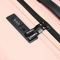 Large check-in suitcase, peach, black combination lock and cross straps