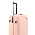 Peach hard-shell suitcase with upright handle and textured side panel