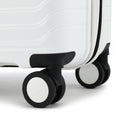 Medium check-in suitcase wheel set with black corner guard and white shell edge.