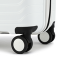 Close-up of white suitcase wheels and base with ridged side panel