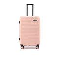 Medium check-in suitcase in peach with black frame handle and four spinner wheels.