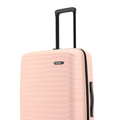 Pink medium check-in suitcase with extended handle and side zipper pocket