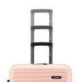Stacked medium check-in suitcases, peach with black pull handles