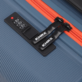 Blue suitcase interior latch and combination lock panel with orange zipper trim