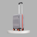 Small cabin suitcase on stand, grey shell with orange trim and 8 wheels