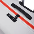 Hard-shell luggage top panel with red zipper stripe, black grip handle, and latch