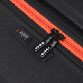 Black hard-shell suitcase with orange zipper trim and HRX logo, side lock area