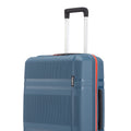 Blue ribbed check-in suitcase with telescopic handle and orange side trim