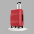 Red hard-shell suitcase with telescopic handle and four spinner wheels