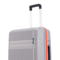 Grey hard-shell suitcase with telescopic handle and red side edge trim