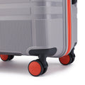Grey hard-shell suitcase with black handle and red-accent spinner wheels