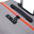 Grey check-in suitcase with orange zipper trim and built-in carry handle